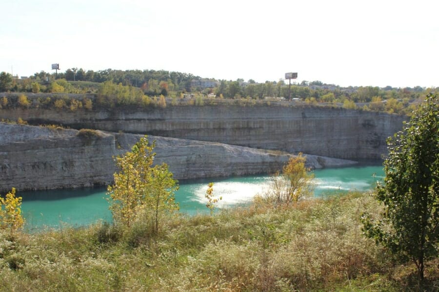 An amazing area at Weber Quarry filled with trees, cliffs, and a river