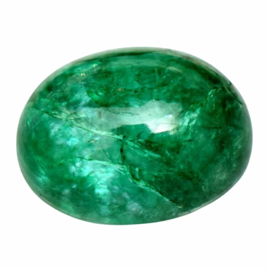 oval deep green emerald cabochon with inclusions