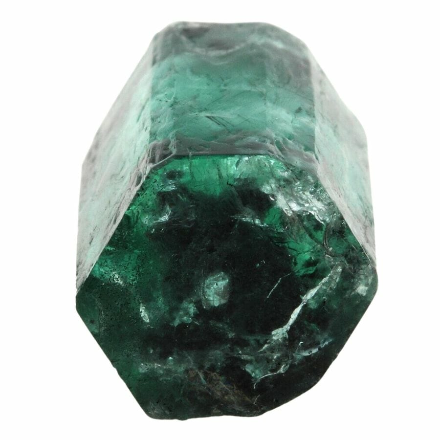 deep green emerald crystal prism showing six sides and its flat hexagonal base