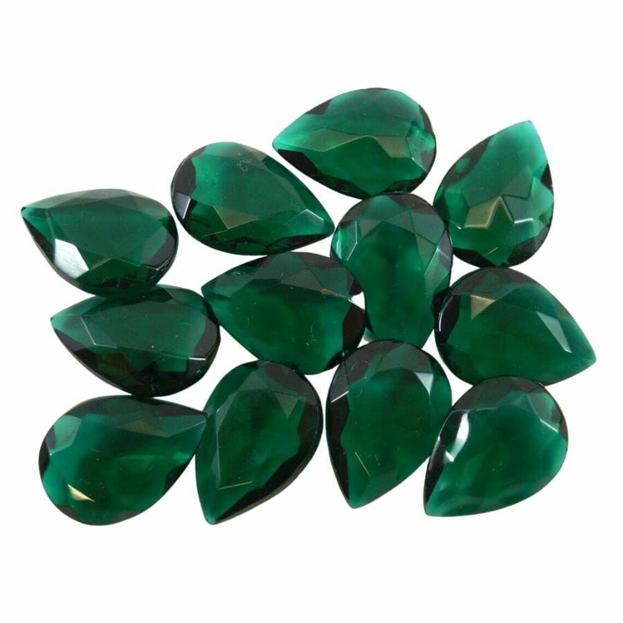 several pear cut dark green glass pieces