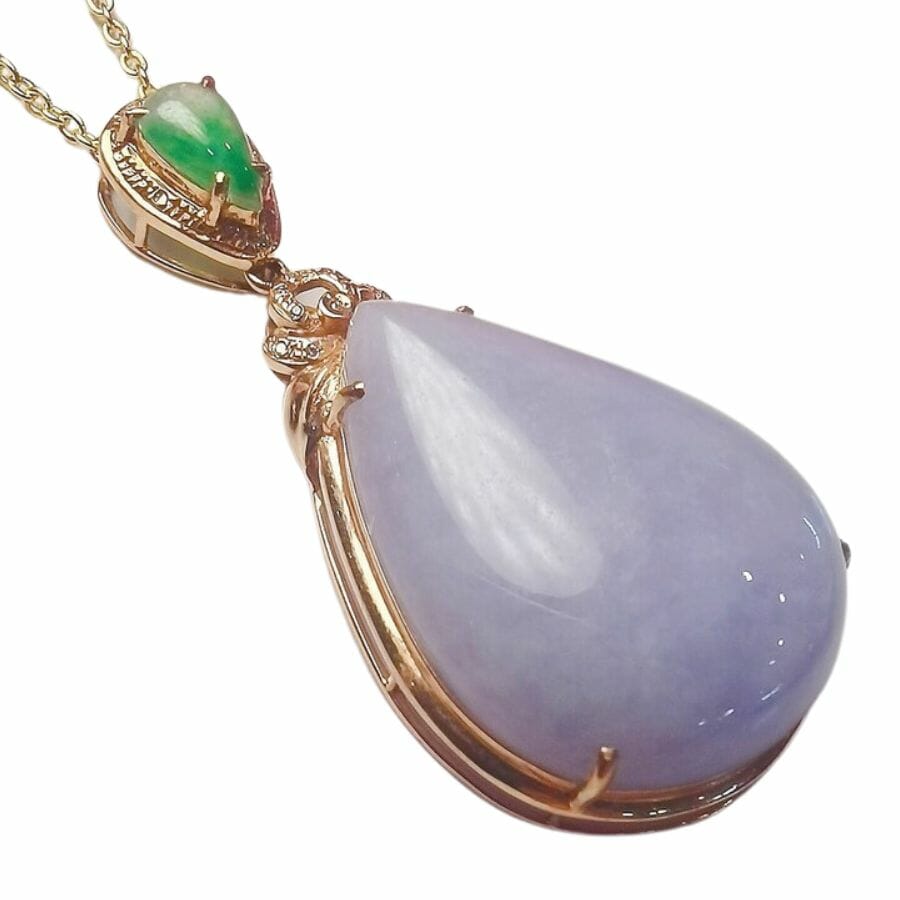 pear shaped lavender jadeite pendant in a gold setting