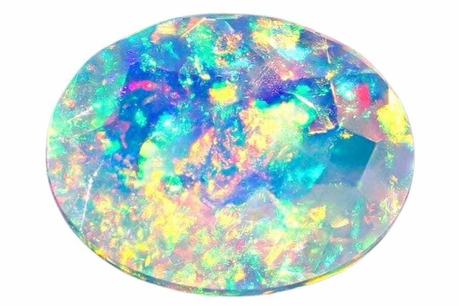 faceted oval cut precious opal with blue, yellow, green, red, and purple swirls