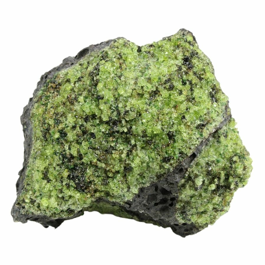 small bright green peridot grains on basalt