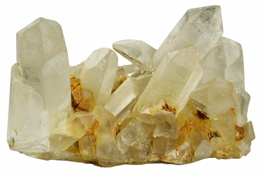 cluster of white translucent quartz crystals, elongated with pointed tips
