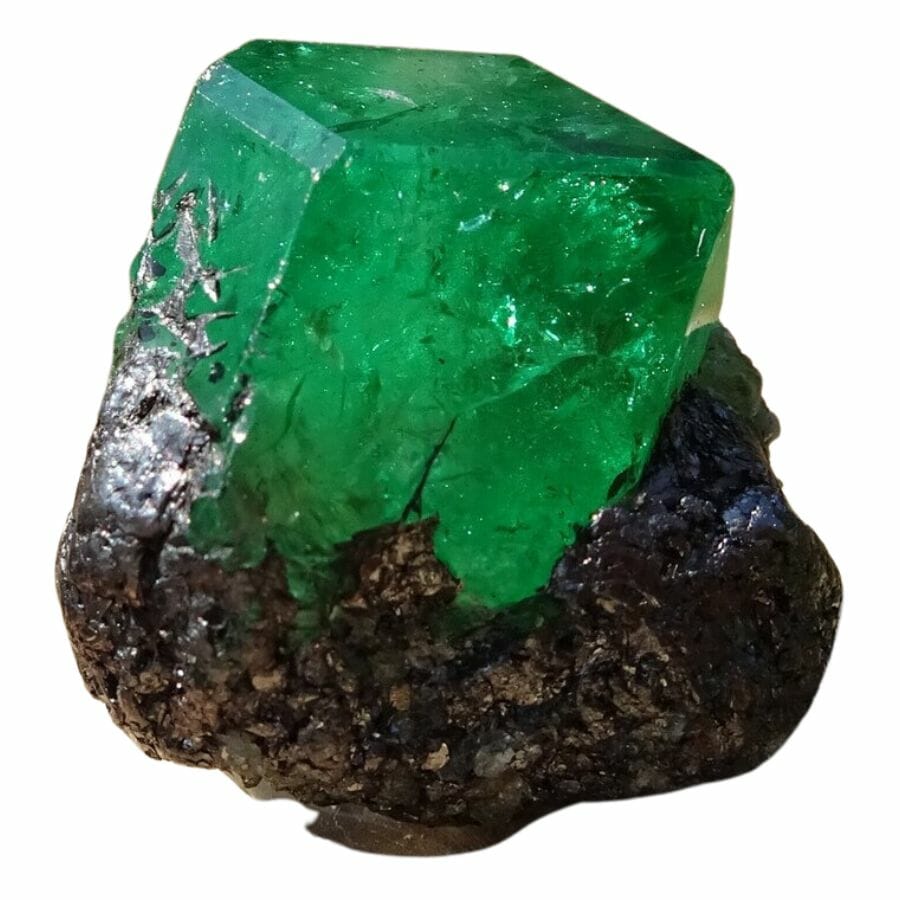 deep green cubic tsavorite crystal in a matrix