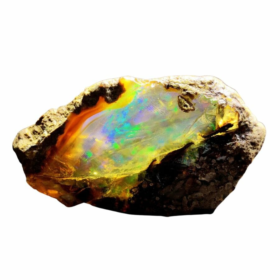translucent opal with bright blue, green, and purple flecks embedded in rock