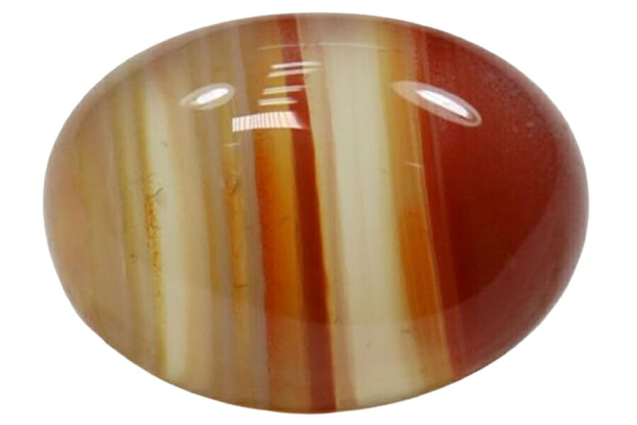 A lovely polished and tumbled agate gemstone with its different color bands