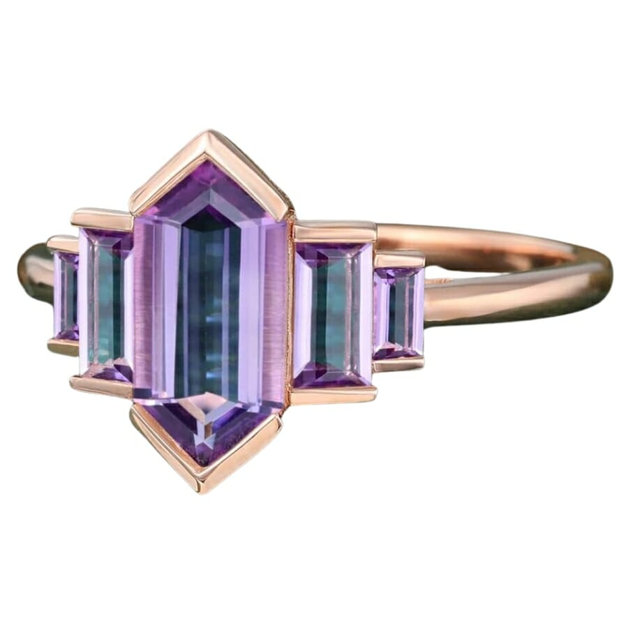 An expensive and luxurious hexagonal amethyst stone rose gold ring