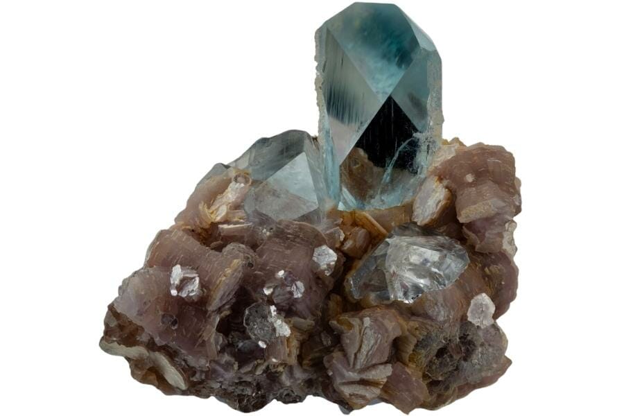 Clear and transparent blue topaz crystals on lepidolite