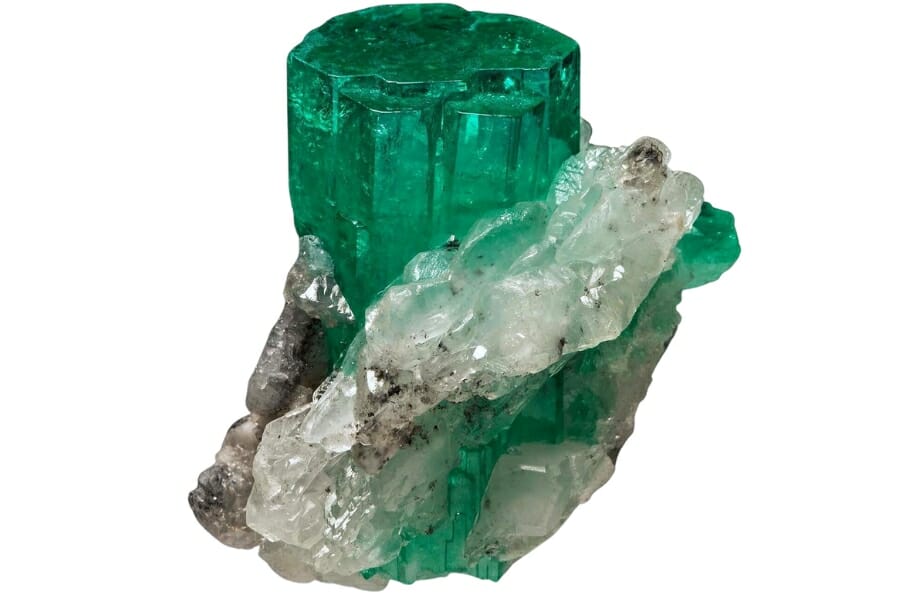 A mesmerizing piece of raw emerald speciment with a white mineral on it