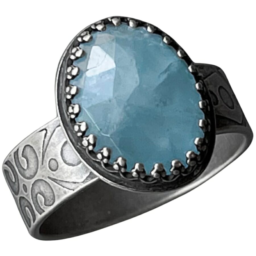 Aquamarine set as centerstone of a thick ring