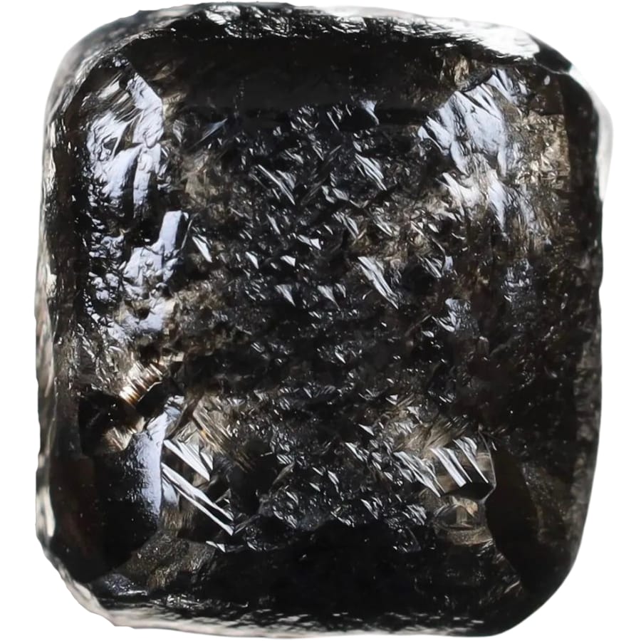 A loose black diamond shaped in a cube