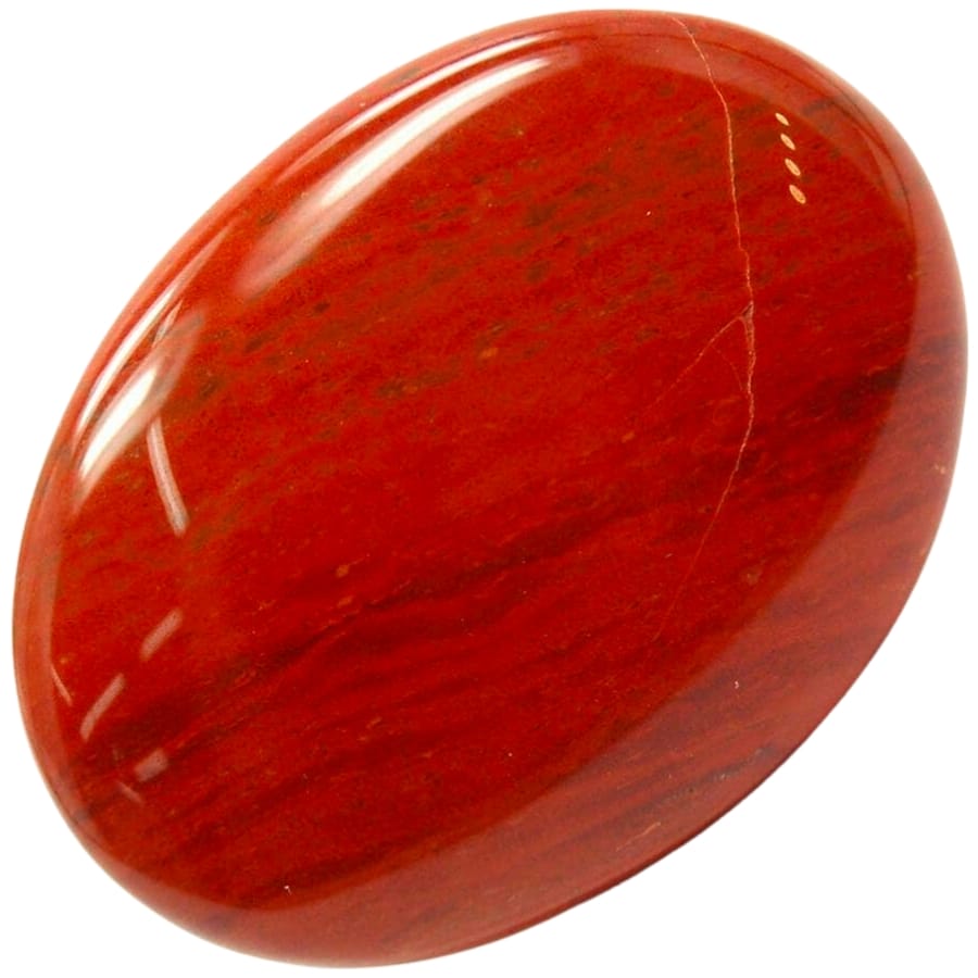 A red jasper cabochon with mesmerizing shine and few black details