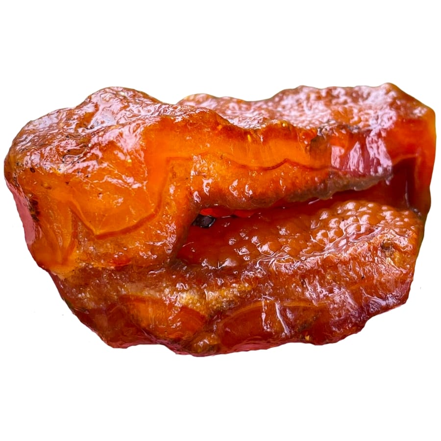 A piece of reddish-orange raw carnelian