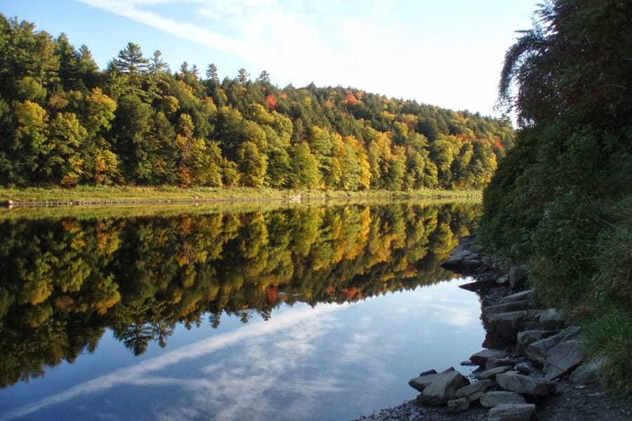 A gorgeous scenic view of the Connecticut River with lush trees and tranquil waters