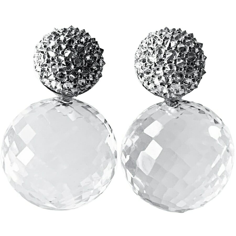 A pair of earrings with large round colorless crystals