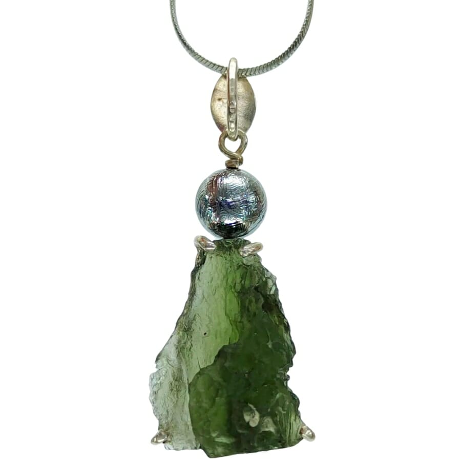 A unique pendant adorned with a rough moldavite