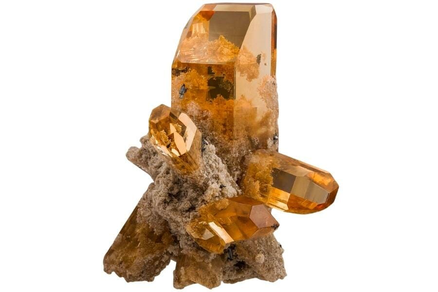 A clear honey-colored topaz on pseudobrookite