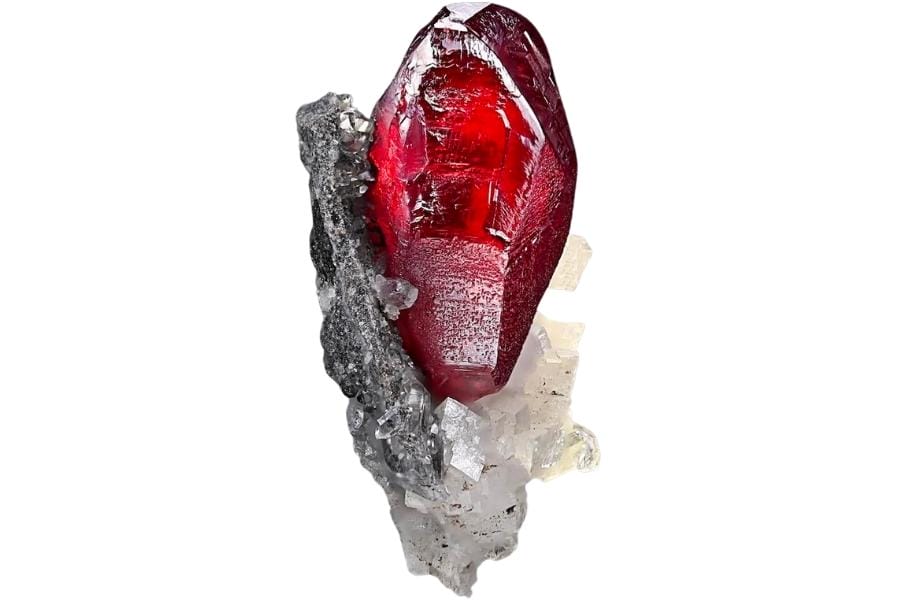A lustrous, vibrant red cinnabar crystal with dolomite