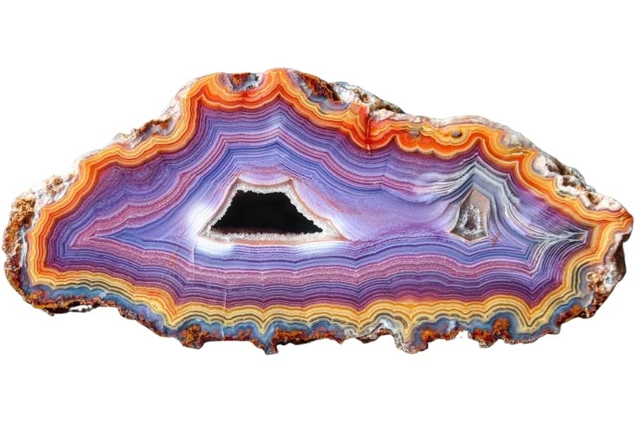 A colorful banded agate with yellow, orange, purple, blue, and indigo bands
