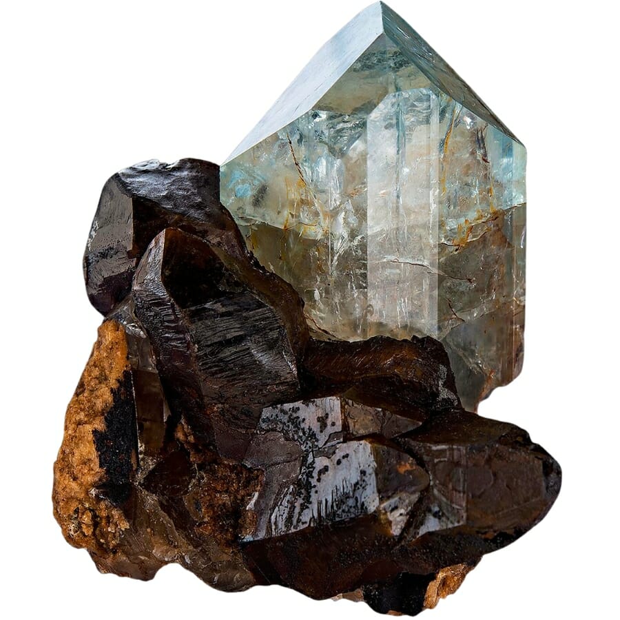 Gemmy blue topaz set on a matrix of rusty smoky quartz