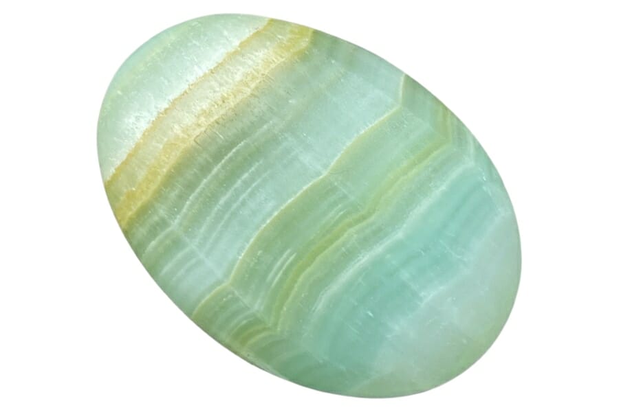 A lovely polished green calcite gemstone with lined patterns