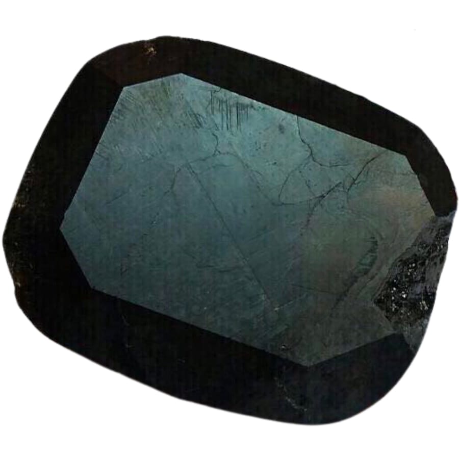 A polished black diamond in a shape of a cushion