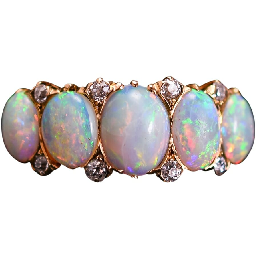 A dreamy antique five stone opal ring