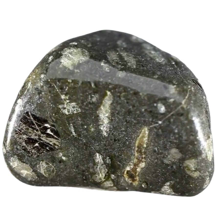 A polished kimberlite tumblestone with little inclusions and white patches