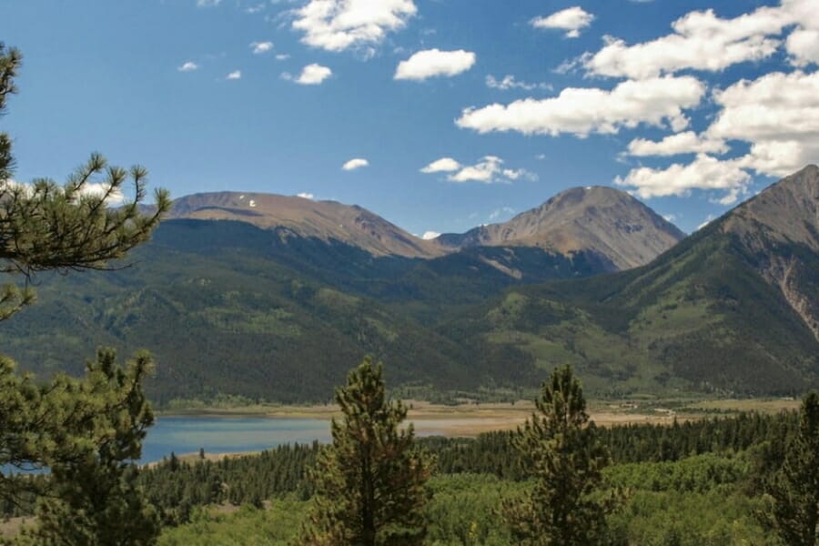 A beautiful area at Lake county in Colorado with a blue lake and green forests