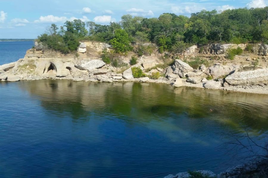 Calm waters and surrounding layers of rocks at Lake Texoma