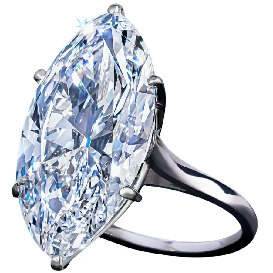 A sparkling white diamond set on a platinum ring