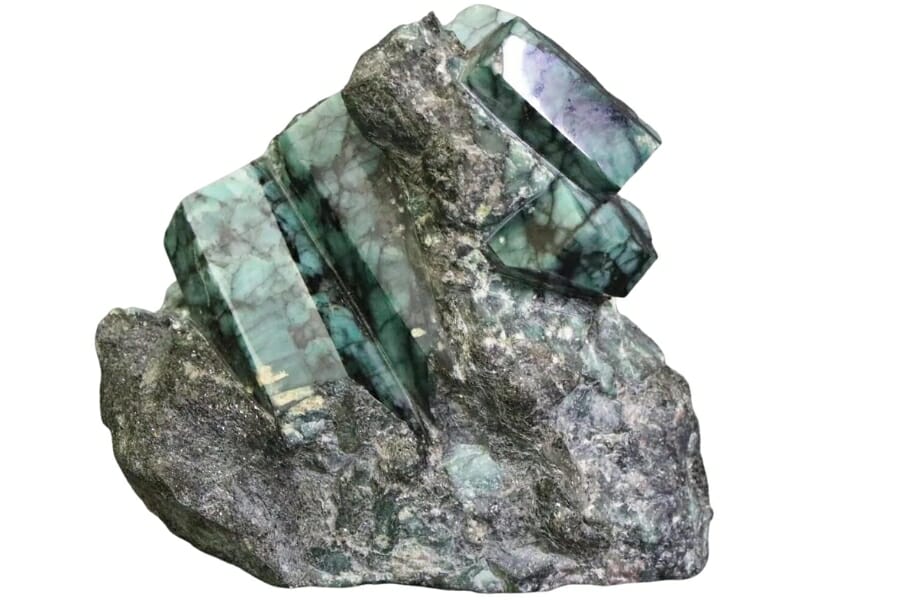 An astounding piece of raw emerald specimen still on its matric