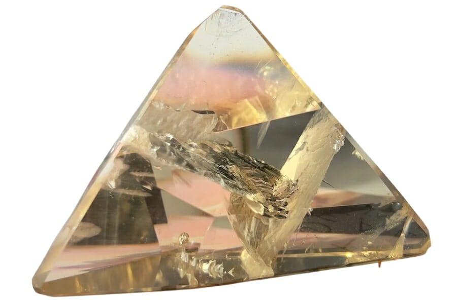 A magnificent triangular shaped polished and transparent pale yellow citrine