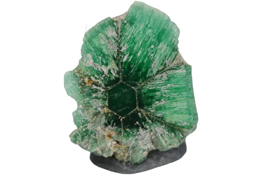 An elegant irregular shaped emerald with a pattern