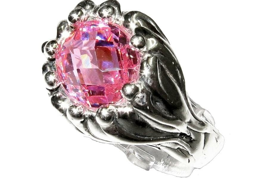 A sparkling polished rose topaz set as a center stone to a sterling ring