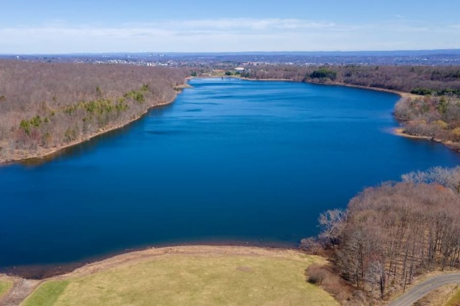 A vast expanse of the Shuttle Meadow Reservoir with clear blue waters