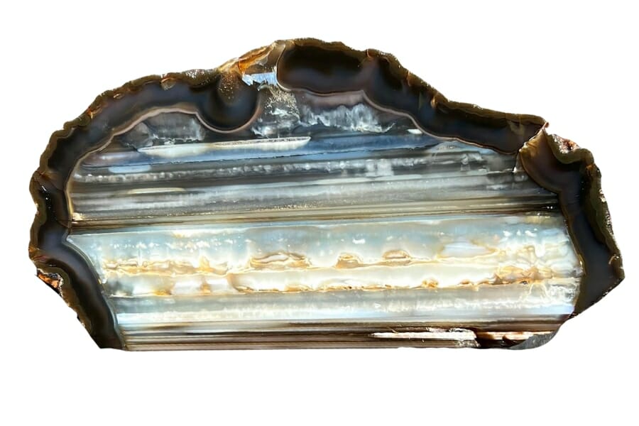 A stunning waterline agate with different blue hues and closely resembles an ocean