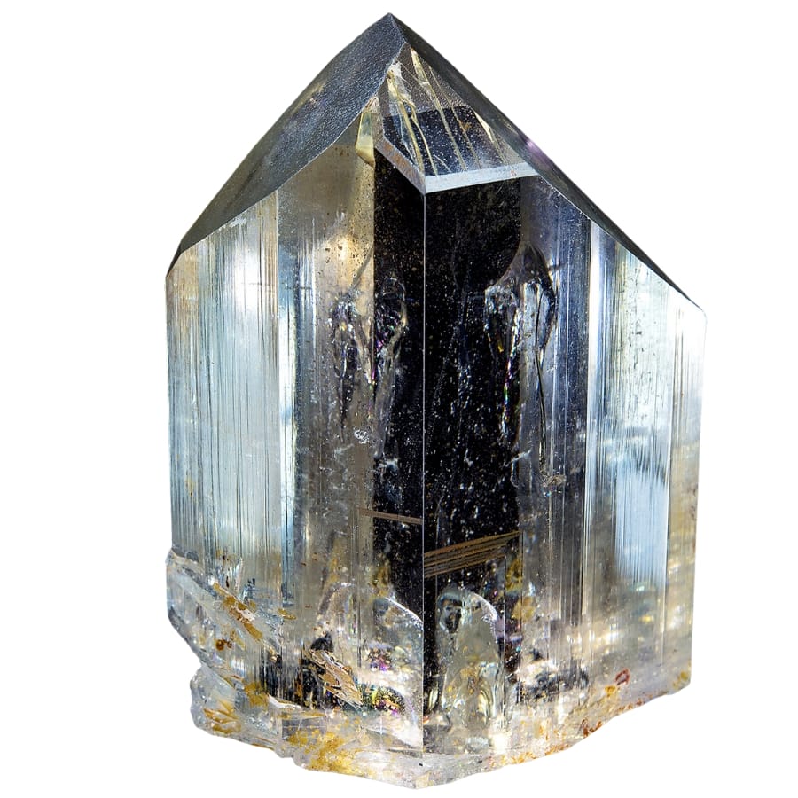 An elegant polished white topaz crystal with a pointy end