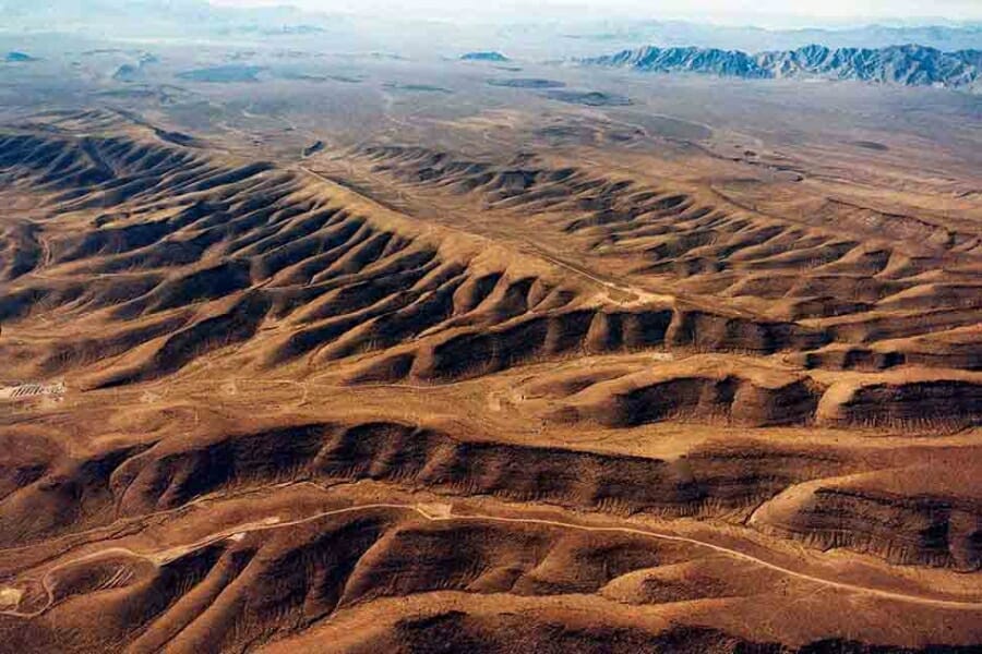 An aerial view of the rugged terrains of Yucca Mountain