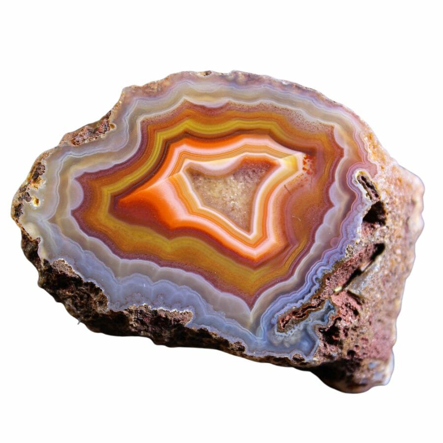 agate cross-section with red, orange, pink, and lavender bands