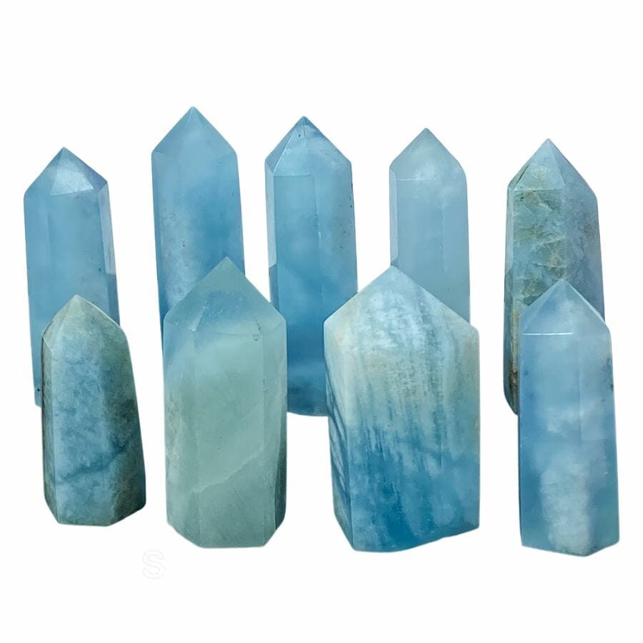nine aquamarine towers in various shades of blue with sharpened points