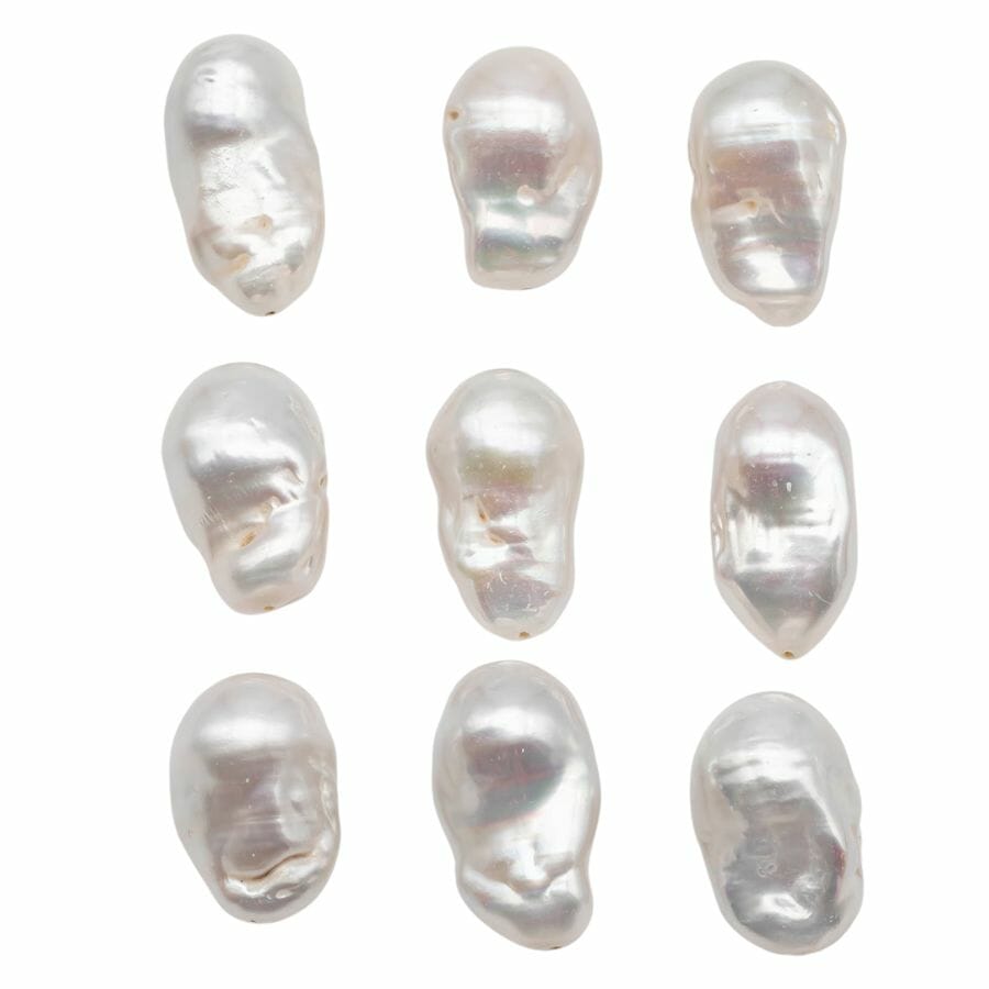 nine elongated irregularly shaped white Baroque pearls