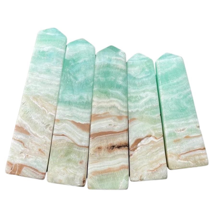 five Caribbean calcite towers with blue, white, and brown layers