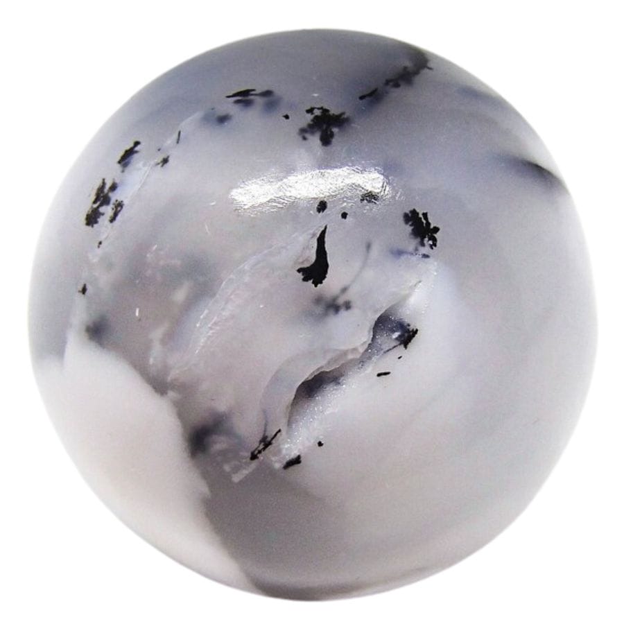 dendritic opal sphere with a translucent portion and a white opaque portion, with black dendrites