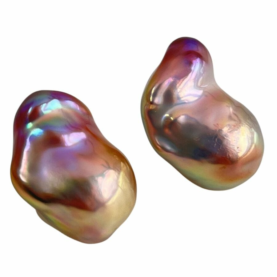 two irregularly shaped Baroque pearls with an iridescent surface