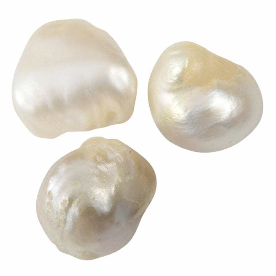 three irregularly shaped white freshwater pearls