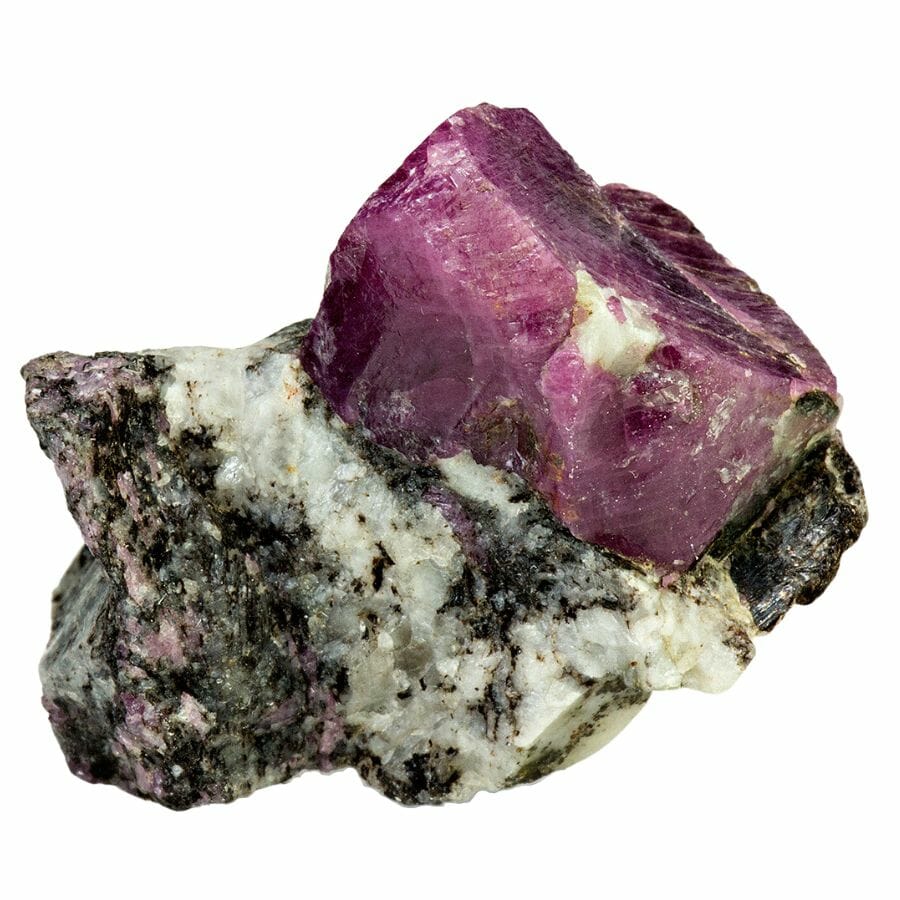 rough deep red ruby crystal in its host rock