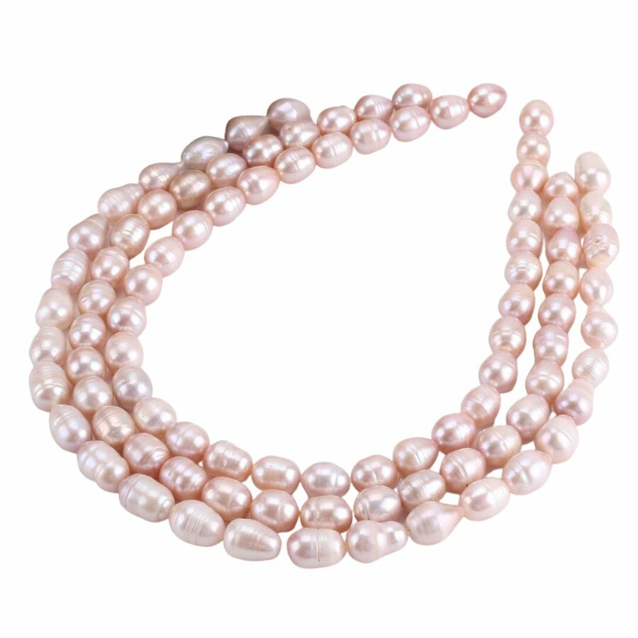 three strings of beige seed pearls