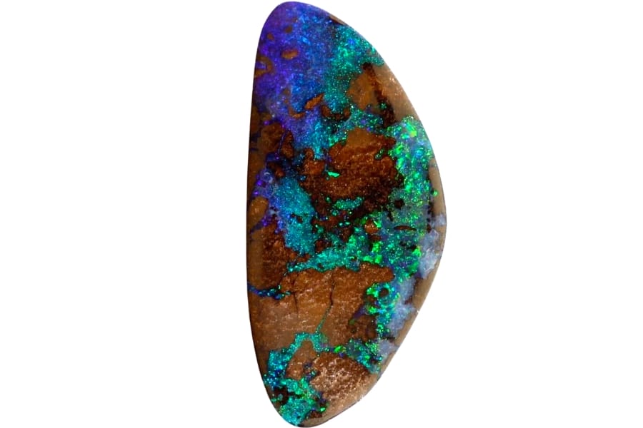 A boulder opal with vibrant green, violet, blue, and green flashes of colors